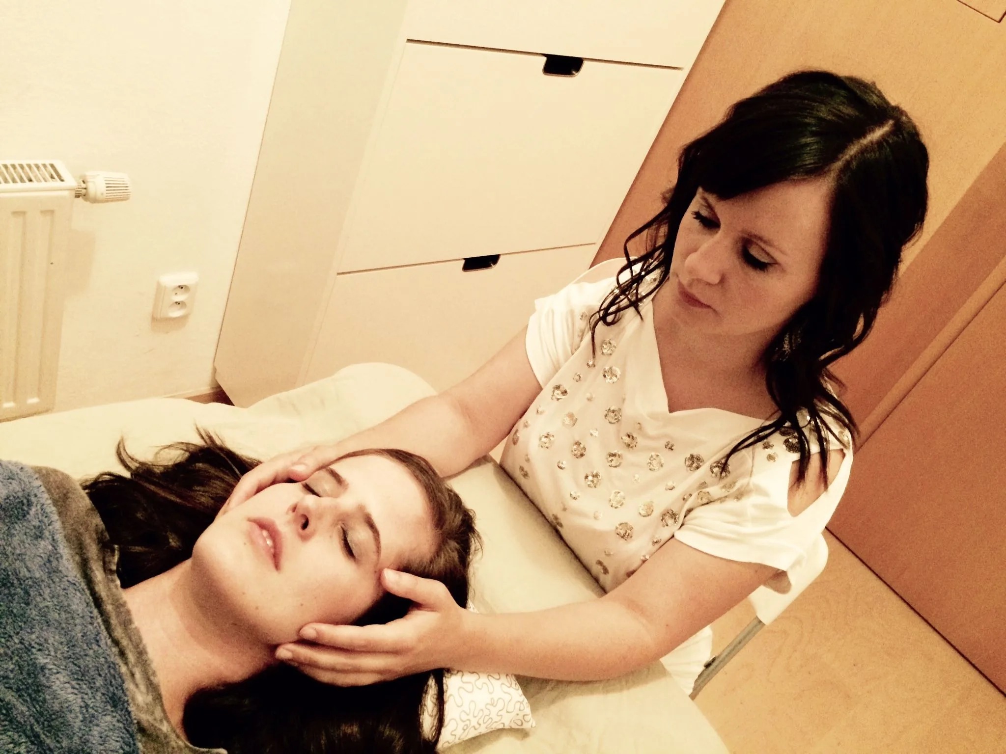 Gentle CranioSacral Therapy session with light touch at the head and upper body