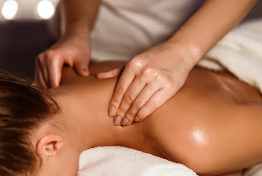 Warm two-table treatment room prepared for online booking appointments