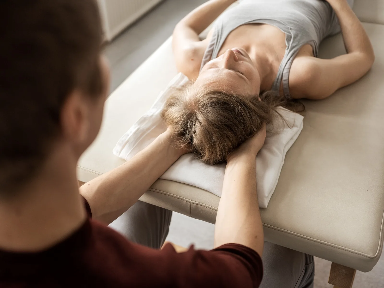 Gentle craniosacral support in a calm treatment setting